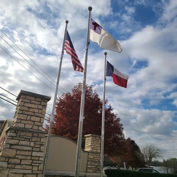Commercial flagpole installation requiring ongoing maintenance